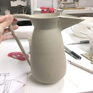 The making of a wheel thrown and altered jug